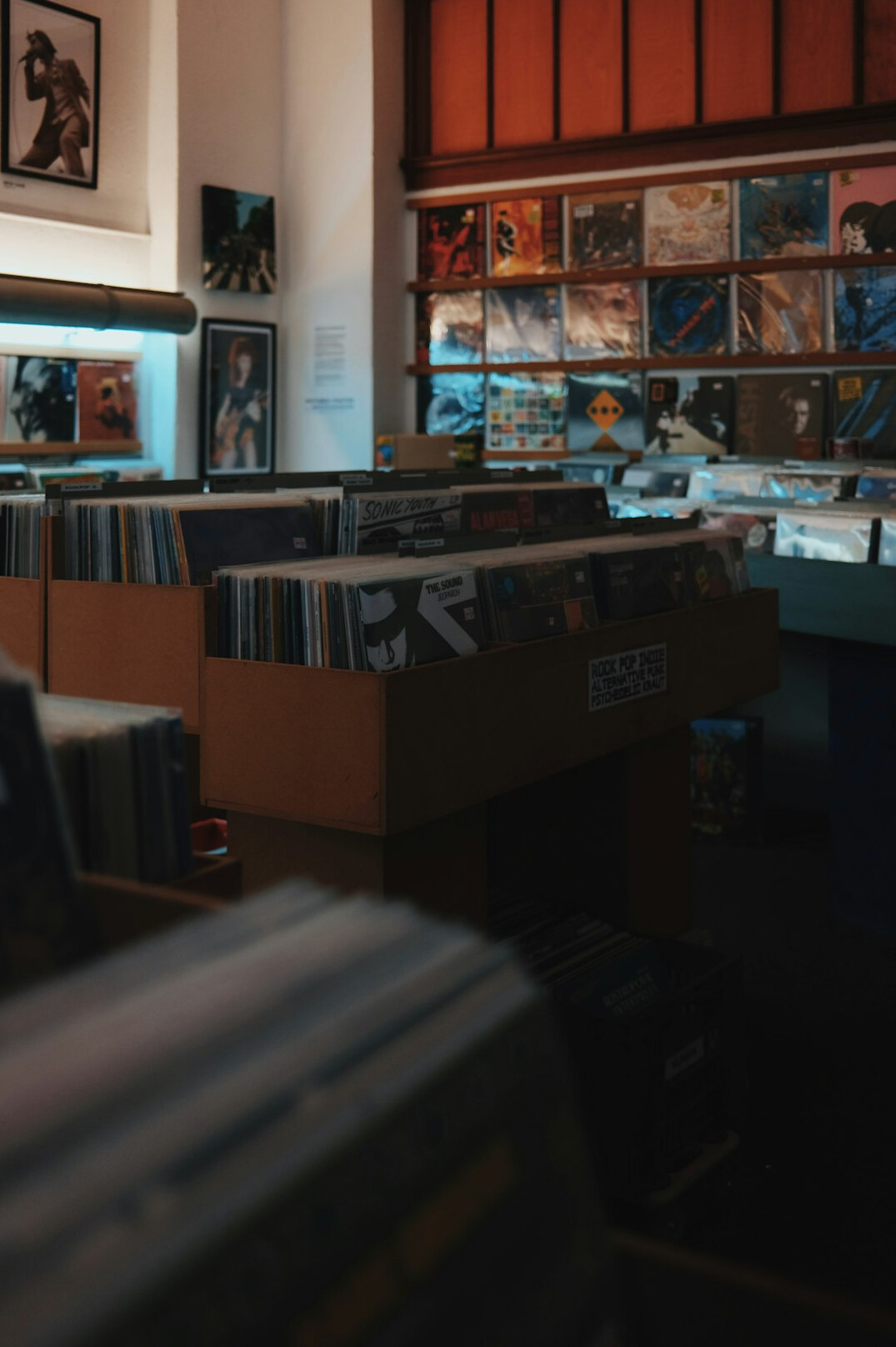 Rows of archival boxes and folders in a records room