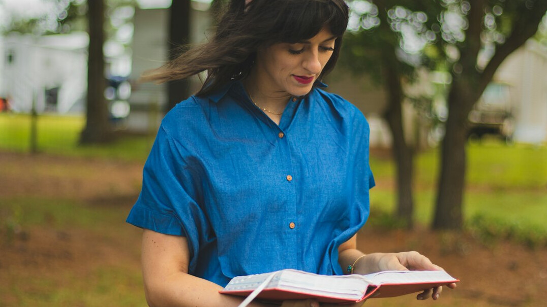Woman journalist reviewing documents at her desk