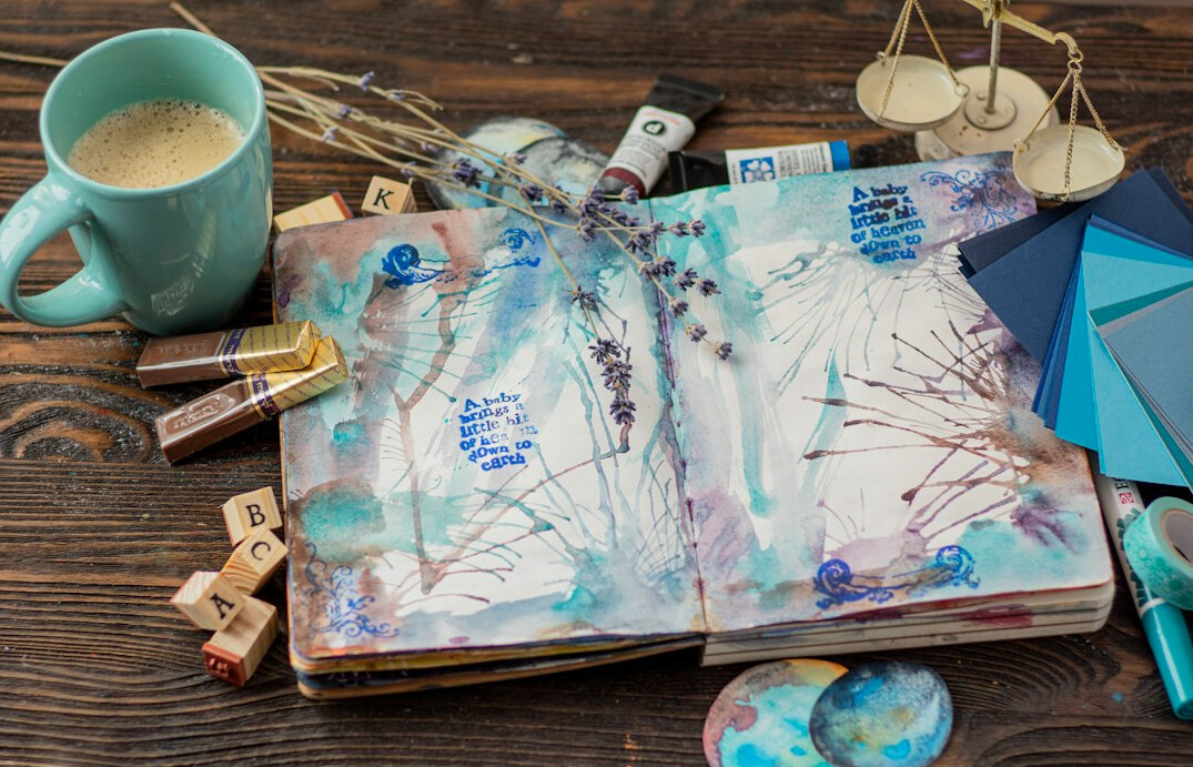 Open notebook with handwritten notes and a magnifying glass