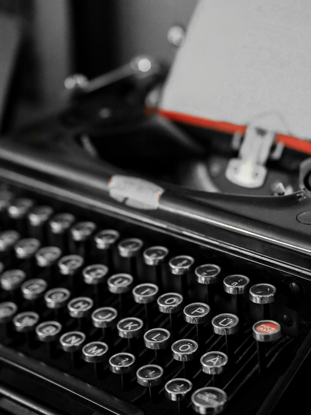 Vintage typewriter with a blank page